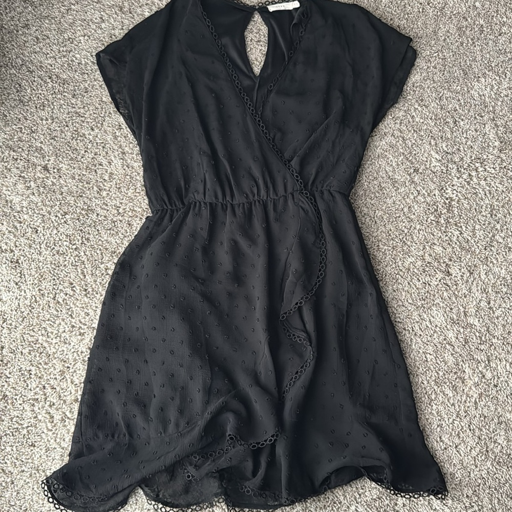 Francesca’s black ruffle dress